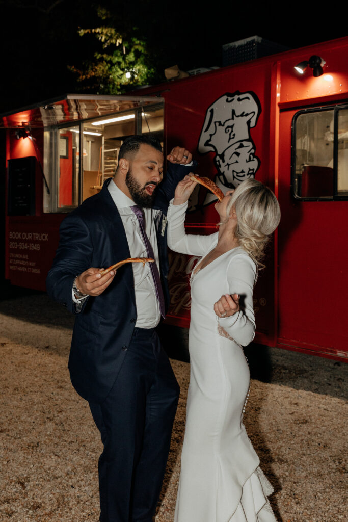 newlyweds dancing with pizza